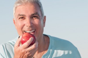 Denture Patient Biting Apple